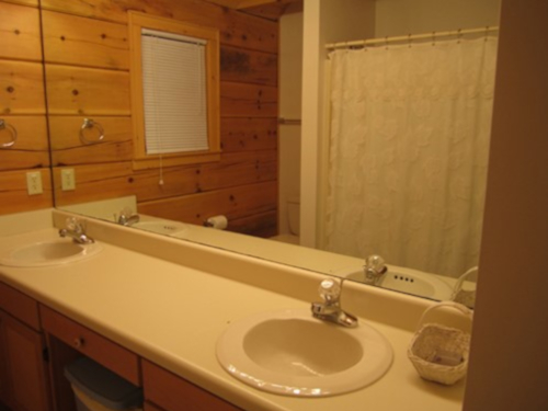 Cable TV, Hot tub, trash pick up, Two queen-size beds includes linens, bathroom shower/tub & two sinks, hairdryer, towels & wash clothes, kitchen includes range, refrigerator, microwave, toaster, coffeemaker | Highland Glade Cabin Rentals | Gatlinburg, TN